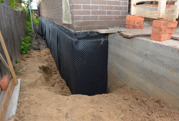 SJ Waterproofing Pros technician performing targeted Exterior Waterproofing assessment in Dayton, TN